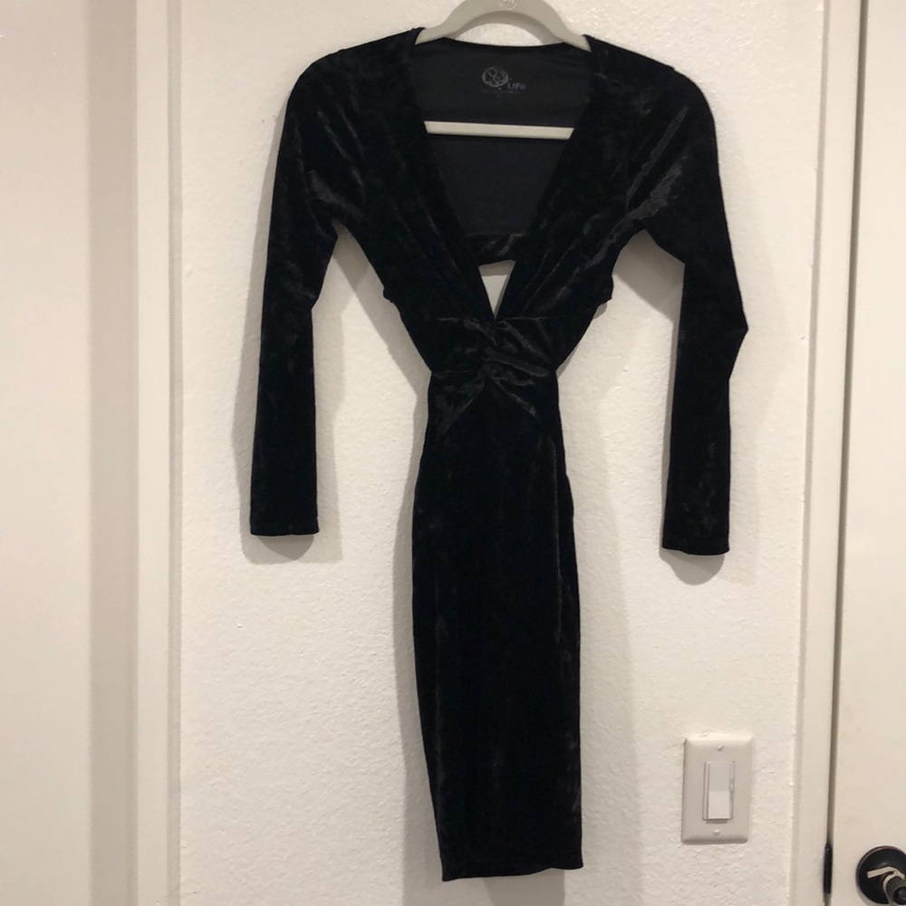 Black velvet plunge neck dress.